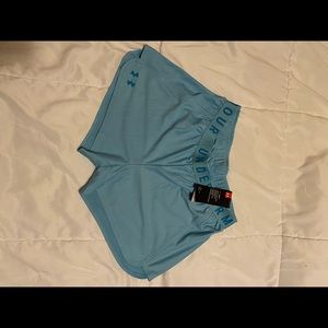Under Armour loose fit heat gear running shorts. Size small